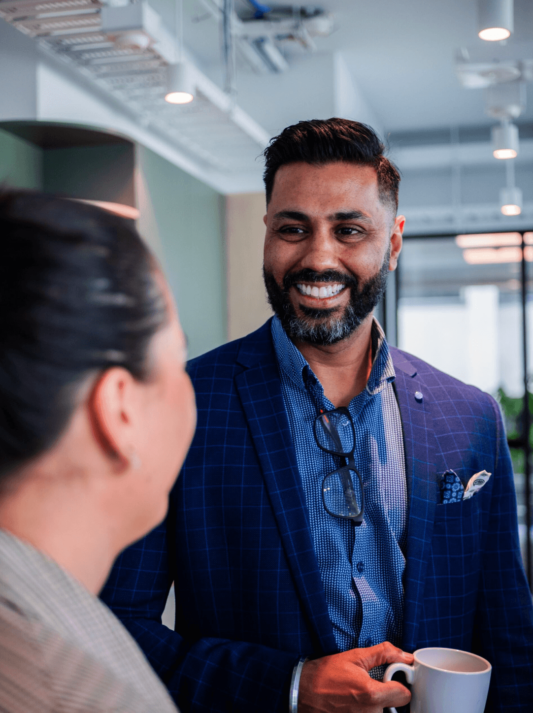 LAB3 team member smiling in a modern office environment